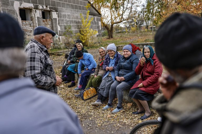 epa10281478 Villagers await the delivery of humanitarian aid in a village between the frontline and Mykolaiv, Ukraine, 02 November 2022. Russian troops on 24 February entered Ukrainian territory, starting a conflict that has provoked destruction and a humanitarian crisis. EPA/HANNIBAL HANSCHKE