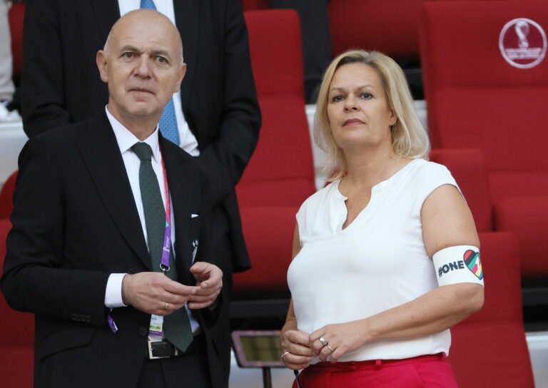epa10322417 German Football Association (DFB) President Bernd Neuendorf (L) and Germany's Sports Minister Nancy Faeser, wearing the 'One Love' armband, arrive for the FIFA World Cup 2022 group E soccer match between Germany and Japan at Khalifa International Stadium in Doha, Qatar, 23 November 2022. EPA/Ronald Wittek