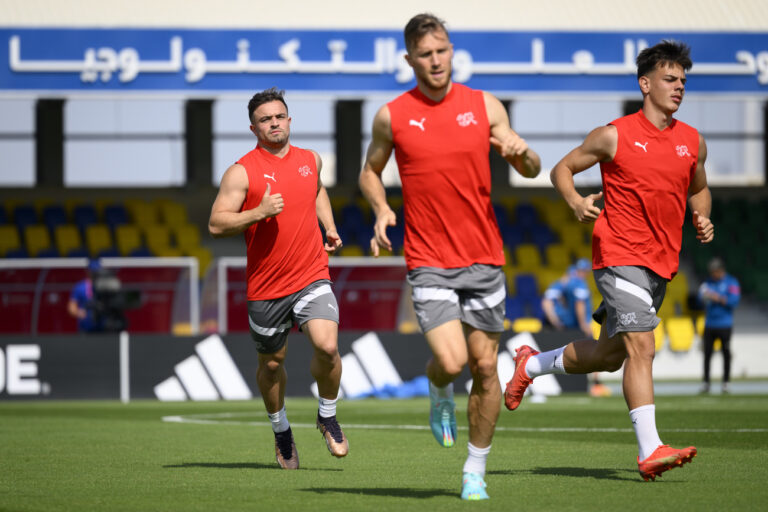 From left, Switzerland's midfielder Xherdan Shaqiri, Switzerland's defender Silvan Widmer and Switzerland's midfielder Ardon Jashari attend a closed training session of Swiss national soccer team on the eve of the FIFA World Cup Qatar 2022 soccer match against Brazil at the University of Doha for Science and Technology training facilities, in Doha, Qatar, Sunday, November 27, 2022. The Swiss national soccer team plays in group G of the upcoming FIFA World Cup Qatar 2022. (KEYSTONE/Laurent Gillieron)
