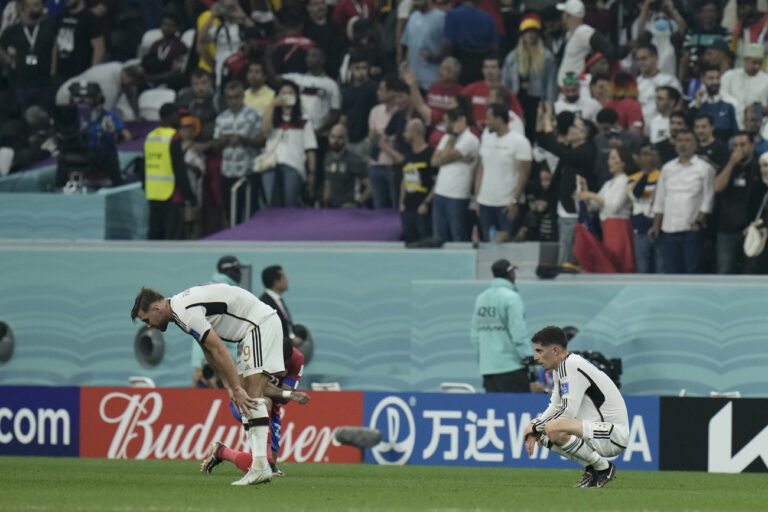 Germany's Niclas Fuellkrug, left, and Kai Havertz react at the end of the World Cup group E soccer match between Costa Rica and Germany at the Al Bayt Stadium in Al Khor , Qatar, Thursday, Dec. 1, 2022. (AP Photo/Hassan Ammar)