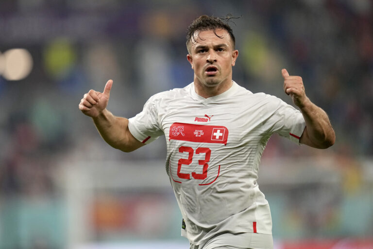 Switzerland's Xherdan Shaqiri celebrates after scoring his side's opening goal during the World Cup group G soccer match between Serbia and Switzerland, at the Stadium 974 in Doha, Qatar, Friday, Dec. 2, 2022. (AP Photo/Ebrahim Noroozi)