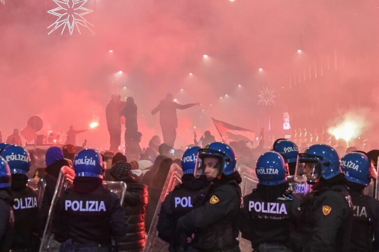 epa10359897 Anti-riot police stand deploy as supporters of Morocco celebrate their team winning the FIFA World Cup 2022 quarter final match between Morocco and Portugal, in Milan, Italy, 10 December 2022. EPA/MATTEO CORNER ITALY OUT