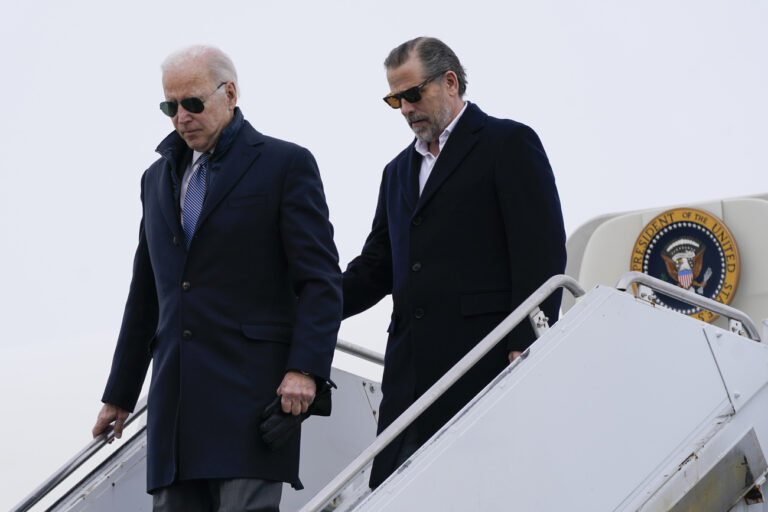 President Joe Biden and his son, Hunter Biden, step off Air Force One, Saturday, Feb. 4, 2023, at Hancock Field Air National Guard Base in Syracuse, N.Y. The Bidens are in Syracuse to visit with family members following the passing of Michael Hunter, the brother of the president's first wife, Neilia Hunter Biden. (AP Photo/Patrick Semansky)