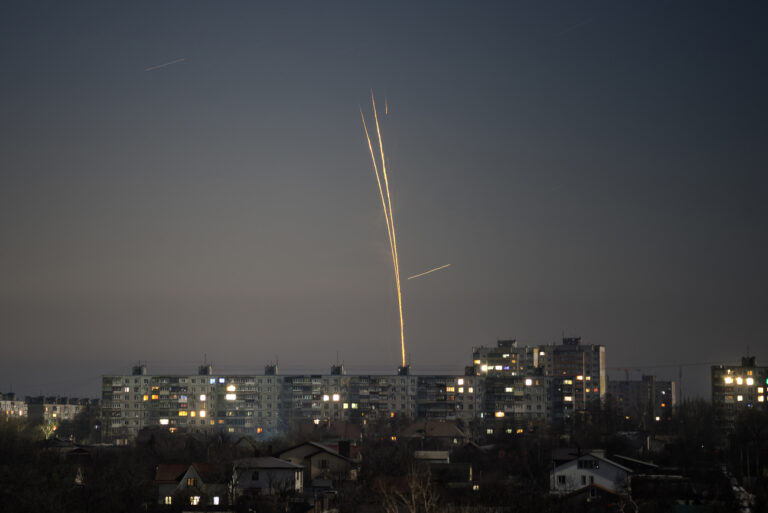 Russian rockets launched against Ukraine from Russia's Belgorod region are seen at dawn in Kharkiv, Ukraine, early Wednesday, Feb. 8, 2023. (AP Photo/Vadim Belikov)