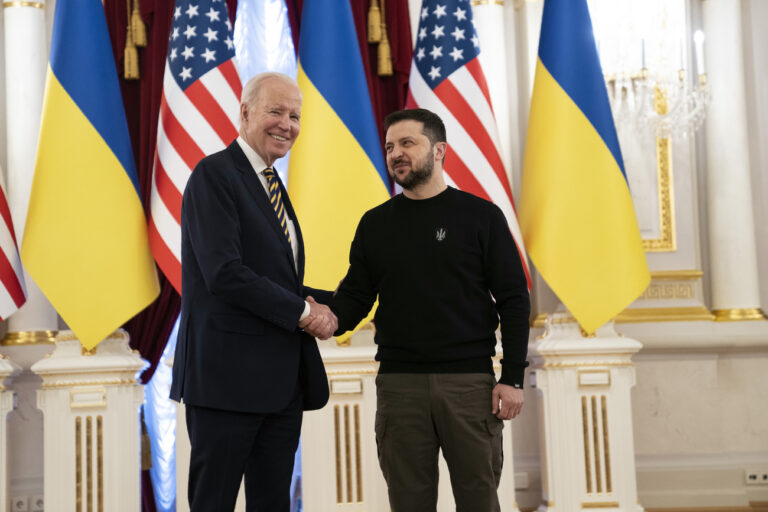 US President Joe Biden, left, shakes hands with Ukrainian President Volodymyr Zelenskyy at Mariinsky Palace during an unannounced visit in Kyiv, Ukraine, Monday, Feb. 20, 2023. (AP Photo/Evan Vucci, Pool)