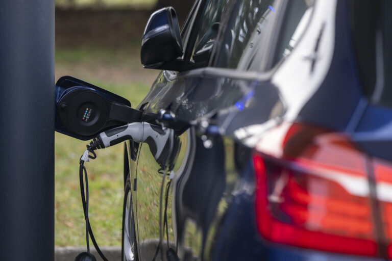 An electric car is being charged at one of the charging stations at the European headquarters of the United Nations in Geneva, Switzerland, Wednesday, February 22, 2023. (KEYSTONE/Martial Trezzini)