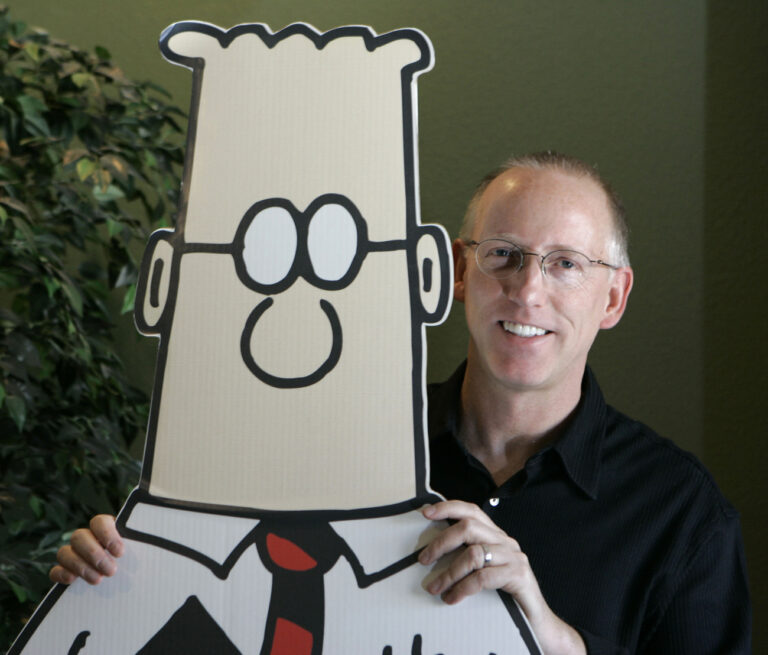 FLE - Scott Adams, creator of the comic strip Dilbert, poses for a portrait with the Dilbert character in his studio in Dublin, Calif., Oct. 26, 2006. Several prominent media publishers across the U.S. are dropping the Dilbert comic strip after Adams, its creator, described people who are Black as members of “a racist hate group” during an online video show. (AP Photo/Marcio Jose Sanchez, File)