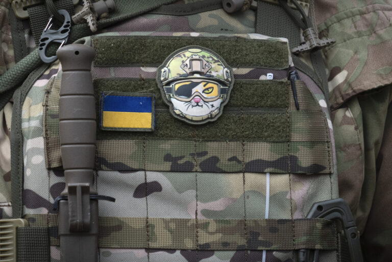 A sticker is seen on the uniform of a Ukrainian serviceman during combat training in Kyiv region, Ukraine, Friday, March. 3, 2023. (AP Photo/Efrem Lukatsky)