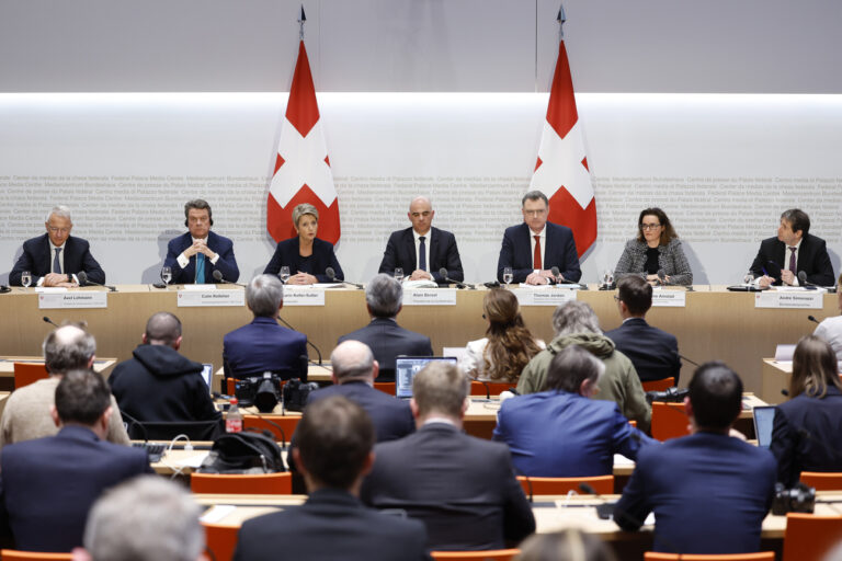 Axel Lehmann, Chairman Credit Suisse, Colm Kelleher, Chairman UBS, Swiss Finance Minister Karin Keller-Sutter, Swiss Federal President Alain Berset, Thomas J. Jordan, Chairman Swiss National Bank, Marlene Amstad, President FINMA, and Andre Simonazzi, chief communication Swiss government, from left, attend a press conference, on Sunday, 19 March 2023 in Bern. Switzerland's largest bank UBS agreed to take over Credit Suisse for 3 billion Swiss francs ($3.25 billion) in a government-brokered deal over the weekend following days of market upheaval over the health of the banking sector. (KEYSTONE/Peter Klaunzer)