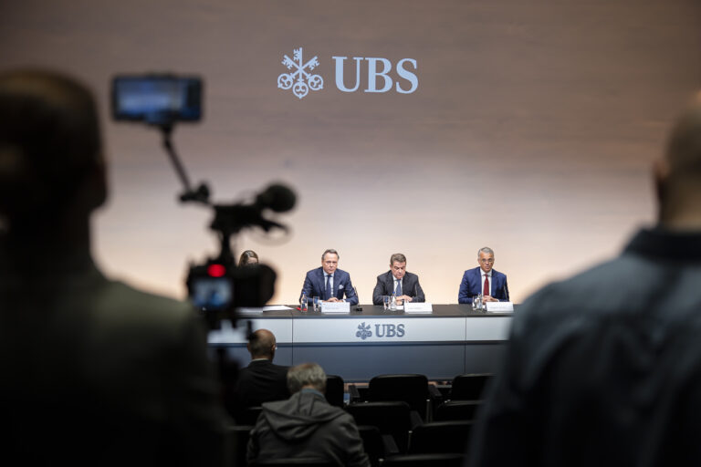 Newly appointed Group Chief Executive Officer of Swiss Bank UBS Sergio P. Ermotti, right, UBS Chairman Colm Kelleher, center, and outgoing CEO Ralph Hamers, left, attend news conference in Zurich, Switzerland on Wednesday, March 29, 2023. (KEYSTONE/Michael Buholzer)