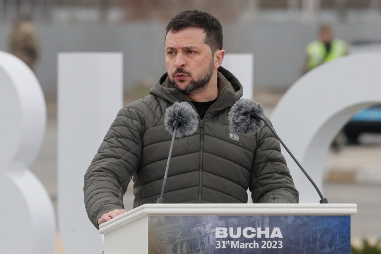 epaselect epa10552269 Ukrainian President Volodymyr Zelensky speaks following a ceremony to raise the State Flag of Ukraine near the city of Bucha, outskirts of Kyiv (Kiev), Ukraine, 31 March 2023. The event was held to mark the first anniversary of the town's 'de-occupation' from Russian troops, some five weeks after Russian forces had entered Ukraine, starting a conflict that has provoked destruction and a humanitarian crisis. EPA/SERGEY DOLZHENKO