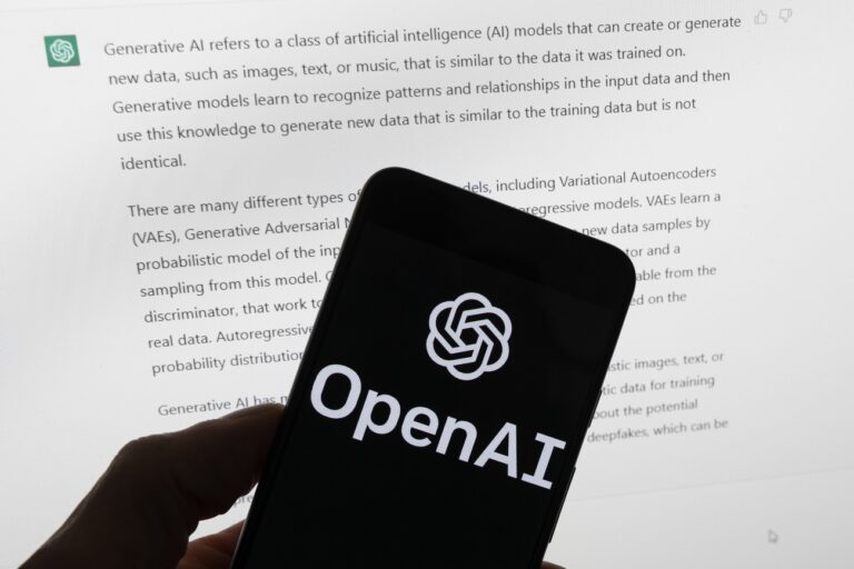 FILE - The OpenAI logo is seen on a mobile phone in front of a computer screen displaying output from ChatGPT, on March 21, 2023, in Boston. The Italian government's privacy watchdog said Friday March 31, 2023 that it is temporarily blocking the artificial intelligence software ChatGPT in the wake of a data breach. (AP Photo/Michael Dwyer, File)