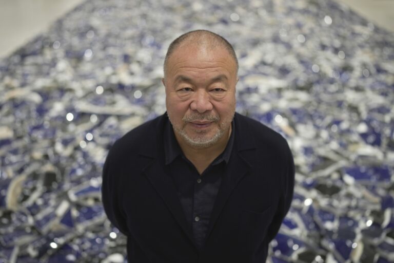 Dissident Chinese artist and activist Ai Weiwei poses for a photograph at his exhibition 