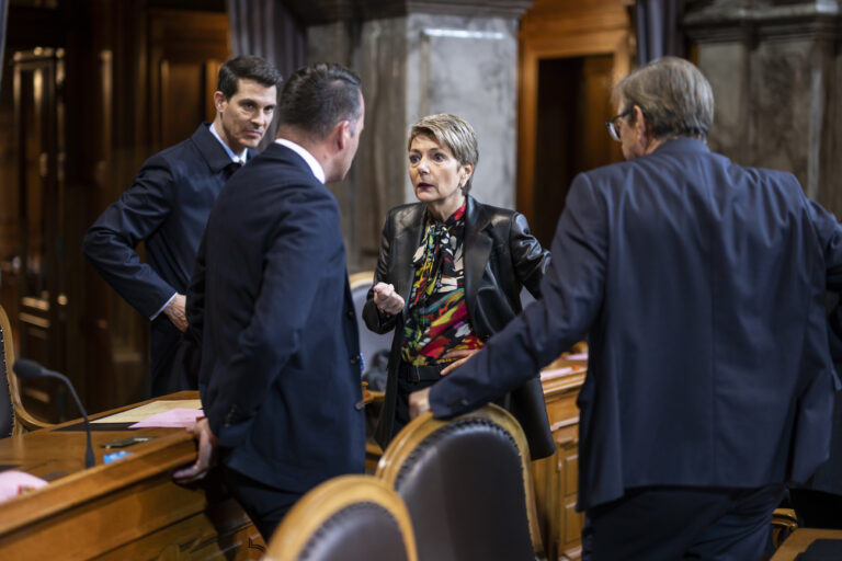 Swiss Finance Minister Karin Keller-Sutter, 2. left, is discussing with Josef Dittli, Damian Mueller, and FDP.The Liberals party president Thierry Burkart, from right, at the extraordinary session of the Federal Assembly, Wednesday, April 12, 2023 in the Council of States in Bern. The extraordinary session was convened to debate the Federal Council's financial decisions to rescue the major bank Credit Suisse CS and its takeover by UBS. (KEYSTONE/Alessandro della Valle)