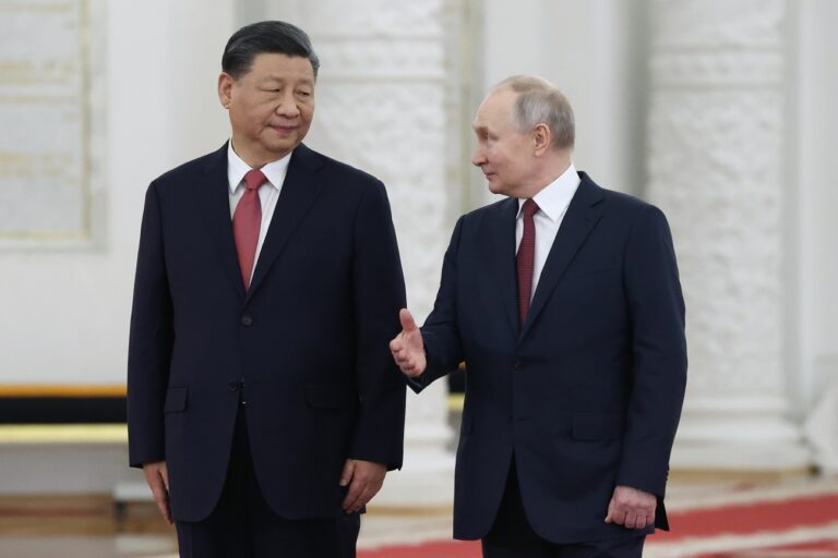 FILE - Russian President Vladimir Putin, right, speaks to Chinese President Xi Jinping as they attend an official welcome ceremony at The Grand Kremlin Palace, in Moscow, Russia, March 21, 2023. Chinese leader Xi Jinping's plan to send an envoy to Ukraine allows his government to deflect criticism of its support for Moscow and pursue a bigger role as a diplomatic force, but Xi faces daunting obstacles if he is serious about trying to help end the 14-month-old war.(Sergei Karpukhin, Sputnik, Kremlin Pool Photo via AP, File)
