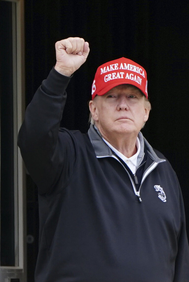 Former US President Donald Trump salutes after arriving at Turnberry golf course, Scotland, during his visit to the UK, Tuesday May 2, 2023. (Jane Barlow/PA via AP)