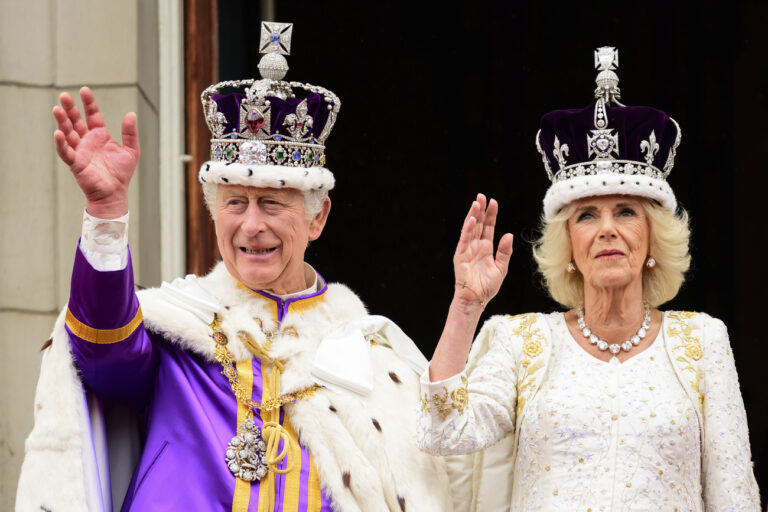 Britain's King Charles III and Queen Camilla wave to the crowds from the balcony of the Buckingham Palace after their coronation, in London, Saturday, May 6, 2023. (Leon Neal/Pool Photo via AP)