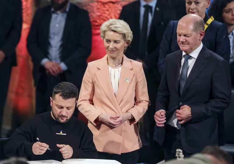 epa10627893 Ukrainian President Volodymyr Zelensky (C) signs the golden book of Aachen beside the Mayor Sibylle Keupen (L), European Commission President Ursula von der Leyen (2-R) and German Chancellor Olaf Scholz (R) after receiving the Charlemagne Prize (Karlspreis) during the award ceremony in the town hall of Aachen, Germany, 14 May 2023. This year's prize is awarded to Ukraine's President Volodymyr Zelensky and the Ukrainian people. The International Charlemagne Prize of Aachen has been awarded annually since 1950 to people who have contributed to the ideals upon which Europe has been founded. EPA/FRIEDEMANN VOGEL / POOL