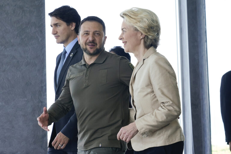 European Commission President Ursula von der Leyen and Ukrainian President Volodymyr Zelenskyy talk as they walk with Canadian Prime Minister Justin Trudeau, left, prior to a working session on Ukraine during the G7 Summit in Hiroshima, Japan, Sunday, May 21, 2023. (AP Photo/Susan Walsh, POOL)