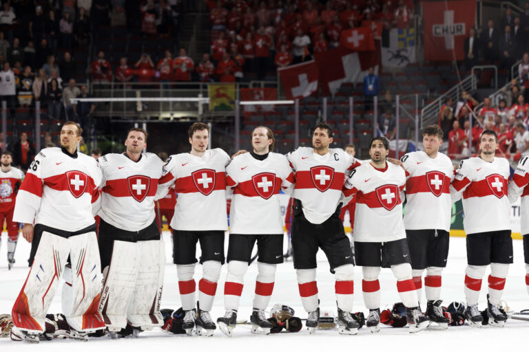 Switzerland's players listen the Swiss anthem after defeating the Team Czech Republic's, during the IIHF 2023 World Championship preliminary round group B game between Czech Republic and Switzerland, at the Riga Arena, in Riga, Latvia, Sunday, May 21, 2023. (KEYSTONE/Salvatore Di Nolfi)
