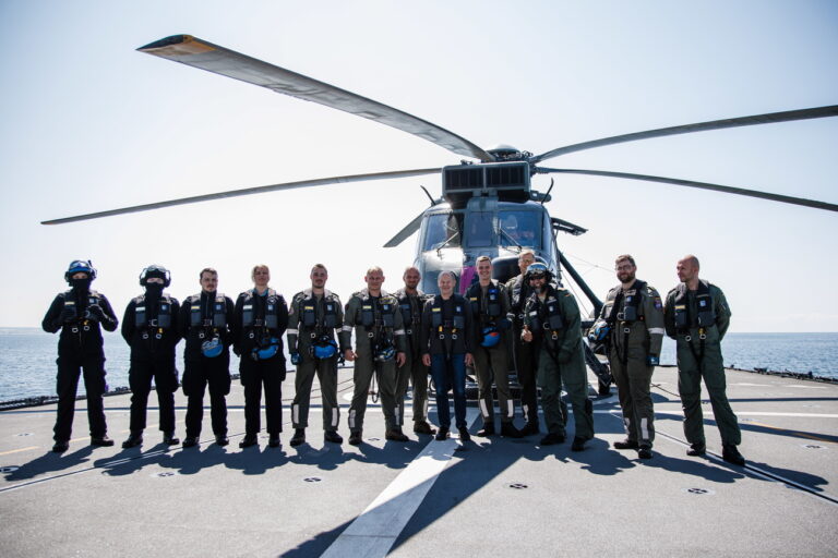 epa10674675 German Chancellor Olaf Scholz (6-R) poses with the helicopter air and ground crew of the frigate 'Mecklenburg-Vorpommern', during a visit to the German Navy in Rostock, Germany, 05 June 2023. German Chancellor Olaf Scholz visited the German Navy at Rostock and attended operational demonstrations at the Frigate 'Mecklenburg-Vorpommern' in the Baltic Sea waters off Rostock. EPA/CLEMENS BILAN