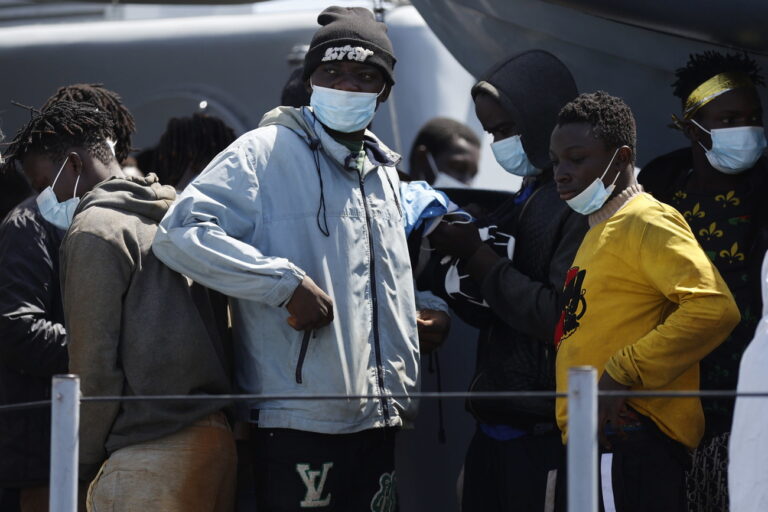 epa10692600 Migrants arrive to the harbor of the Sicilian island of Lampedusa (Agrigento) after being rescued by a Guardia di Finanza ship to be transferred to Lampedusa immigrant reception facility, or 'hotspot', southern Italy, 14 June 2023 (issued 15 June 2023). The Lampedusa hotspot, with a capacity to host about 650 people, is managed by the Italian Red Cross (CRI). The center is intended to provide preliminary reception, identification and triage for migrants and refugees arriving on the tiny southern Italian island. Located in the Mediterranean between Malta and Tunisia, Lampedusa is a transit point for migrants from Africa, the Middle East and Asia seeking a better life in Europe. Upcoming 20 June 2023 marks World Refugee Day under the theme 'hope away from home'. The annual international day celebrates the people around the glove who have been forced to flee their home country to escape conflict or persecution. EPA/VINCENZO LIVIERI ATTENTION: This Image is part of a PHOTO SET