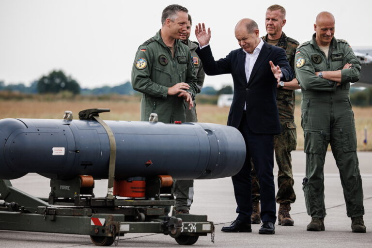 epa10694872 German Chancellor Olaf Scholz (3-L) gestures in front of a reconnaissance pod as he receives explanations on technical equipment, next to Commodore of Tactical Air Force Squadron 51 'Immelmann' Colonel Joerg Schroeder (L) and Chief of Staff of the German Air Force Lieutenant General Ingo Gerhartz (R) during his visit of the NATO Air Defender 2023 exercise, in Jagel, Germany, 16 June 2023. The 'Air Defender 2023' maneuver is the largest North Atlantic Treaty Organization (NATO) redeployment exercise of air forces in its existence and takes place from 12 to 23 June gathering up to 10,000 participants from 25 nations with 250 aircraft to train air operations in European airspace under the command of the German Air Force, the German Armed Forces (Bundeswehr) explains on their website. EPA/CLEMENS BILAN