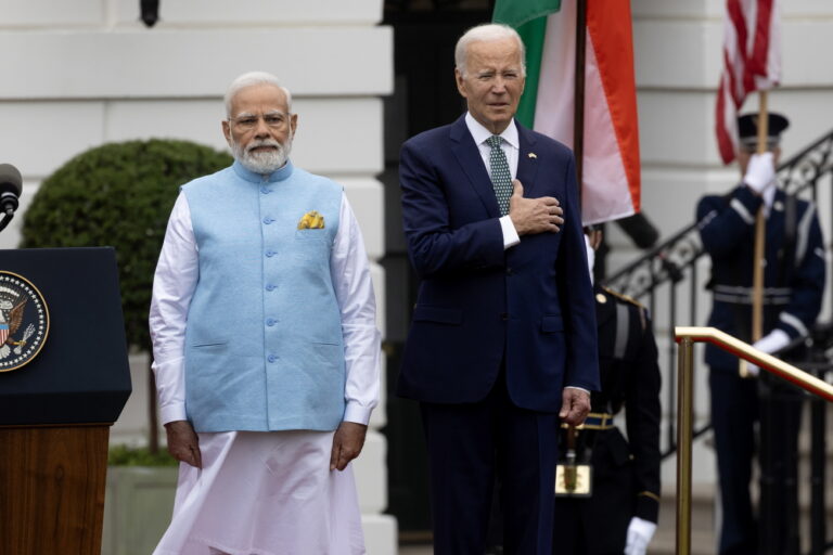epa10706203 US President Joe Biden (R) and Prime Minister of India Narendra Modi (L) observe the playing of the US national anthem during an official welcome ceremony on the South Lawn of the White House in Washington, DC, USA, 22 June 2023. Biden hosts Modi for a state visit, during which they will discuss a variety of issues ranging from security in the Indo-Pacific, technology partnership and climate change. EPA/MICHAEL REYNOLDS