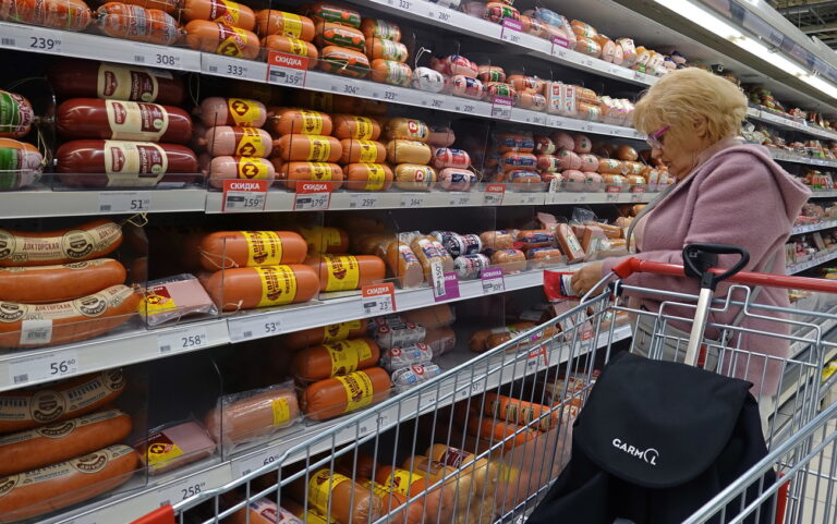 epa10739869 A woman shopping at an Auchan hypermarket in Moscow, Russia, 11 July 2023. As part of the economic sanctions imposed by the West on Russia, due to the start of Russia's 'Special Military Operation' in Ukraine in February 2022, a number of international brands had announced the suspension, limitation or closing of their operations in Russia. French multinational retail group Auchan said in a March 2023 statement that it observed the terms of the embargoes and sanctions on Russia by operating 'within the strict framework of the law', adding that it will remain open in both Ukraine and Russia. EPA/MAXIM SHIPENKOV