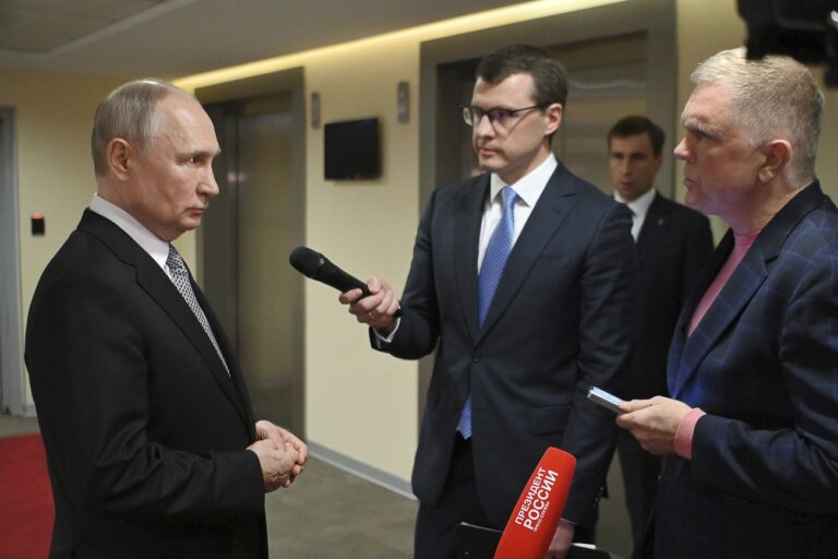 Russian President Vladimir Putin answers journalists' questions about the grain deal in Moscow, Russia, Thursday, July 13, 2023. (Alexander Kazakov, Sputnik, Kremlin Pool Photo via AP)