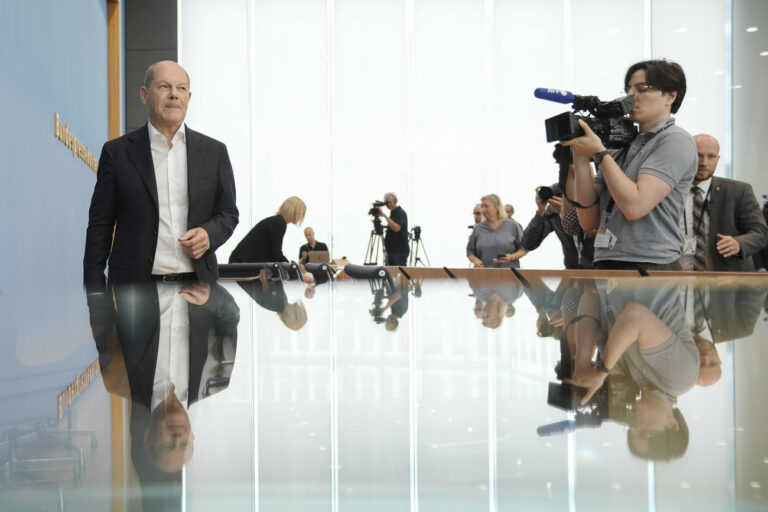 German Chancellor Olaf Scholz leaves his annual summer press conference in Berlin, Germany, Friday, July 14, 2023. (AP Photo/Markus Schreiber)