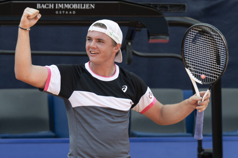 Dominic Stricker of Switzerland celebrates his victory against Arthur Fils of France at the Swiss Open tennis tournament in Gstaad, Switzerland, on Tuesday, July 18, 2023. (KEYSTONE/Peter Schneider)