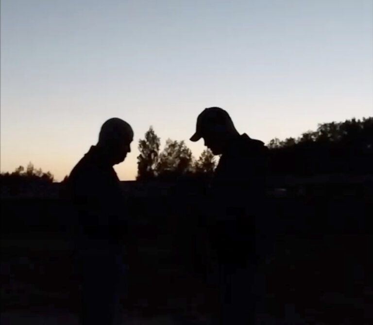 This image from video released Wednesday, July 19, 2023, appears to show Russian mercenary chief Yevgeny Prigozhin, left, for the first time since he led a short-lived rebellion in June. The grainy video of him speaking to troops at a field camp purportedly in Belarus, was posted on a messaging app channel linked to Prigozhin's Wagner private military company. (AP Photo)