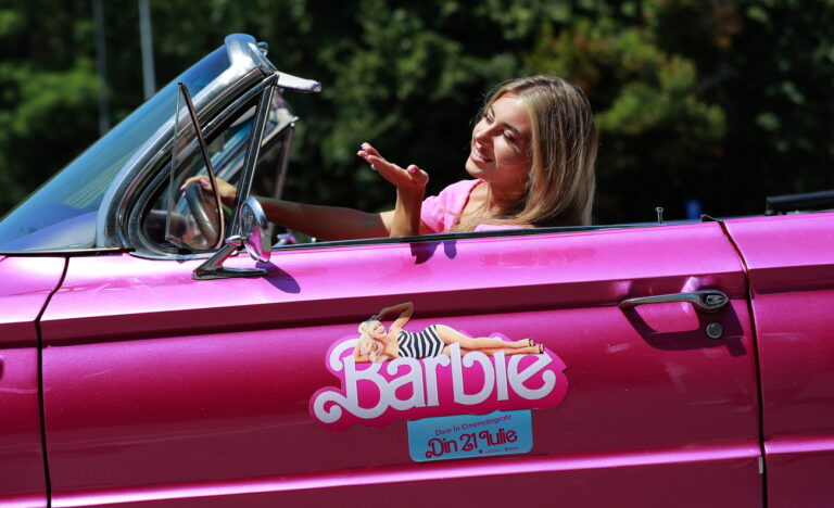 epa10760179 Romanian woman Andra, dressed in Barbie pink outfit, poses inside a pink Uber car during an event called 'Uber Pink', ahead of the 'Barbie' movie premiere in Bucharest, Romania, 21 July 2023. The ridesharing company UBER and the company that distributes the movie 'Barbie' in Romania, Vertical Entertainment, have announced the launch of Uber Pink, an experience for Barbie fans in Bucharest. On the day of the international premiere of the movie 'Barbie', July 21, people of Bucharest will have the opportunity to step into the World of Barbie by traveling in a pink Buick Invicta, a convertible vintage car, recalling the aesthetics of the long-awaited movie. Uber Pink will be available for free to those who want it, following a predefined 20 minutes route around the Kiseleff Park in the Romanian capital. 'Barbie' is a film directed by the director and screenwriter Greta Gerwig, starring Margot Robbie (Barbie) and Ryan Gosling (Ken) produced for Warner. Bros Pictures by Heyday Films, LuckyChap Entertainment and Mattel. EPA/Robert Ghement