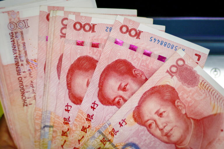 epa10791423 An illustration picture shows banknotes of 100 Chinese Yuan or Renminbi (RMB) in Beijing, China, 09 August 2023. China's consumer price index declined 0.3 percent in July compared to last year, National Bureau of Statistics said. EPA/MARK R. CRISTINO