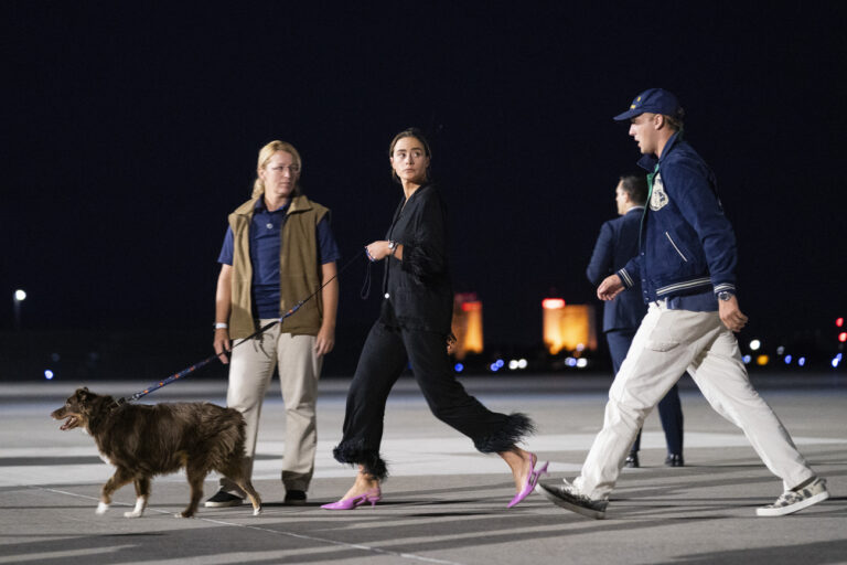 Naomi Biden, President Joe Biden's granddaughter, arrives with her husband, Peter Neal, at Reno-Tahoe International Airport in Reno, Nev., Friday, Aug. 18, 2023, for a family vacation. (AP Photo/Evan Vucci)