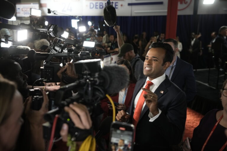 Businessman Vivek Ramaswamy talks with reporters in the spin room after a Republican presidential primary debate hosted by FOX News Channel Wednesday, Aug. 23, 2023, in Milwaukee. (AP Photo/Morry Gash)