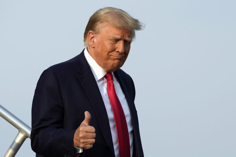 Former President Donald Trump steps off his plane as he arrives at Hartsfield-Jackson Atlanta International Airport, Thursday, Aug. 24, 2023, in Atlanta. (AP Photo/Alex Brandon)