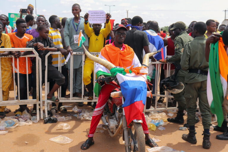 epa10824344 A supporter of the military junta displays a flag of Russia during a rally at at a roundabout leading to the French airbase during a rally in Niamey, Niger, 27 August 2023. The junta gave the French ambassador to Niger 48 hours to leave the country. EPA/ISSIFOU DJIBO