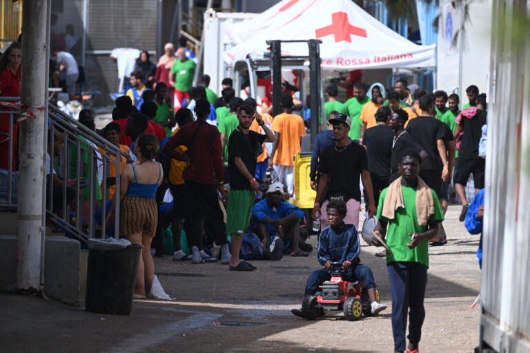 epa10869394 Some of the 185 migrants disembarked after the four boats they were travelling on were docked overnight by patrol boats from the Guardia di Finanza and the Captaincy in Lampedusa, Italy, 19 September 2023. 475 migrants arrived in Lampedusa 18 September. According to Italy's Interior Ministry, nearly 126,000 immigrants and refugees have entered the country as of 2023, more than twice as many as during the same time period in 2022. EPA/CIRO FUSCO