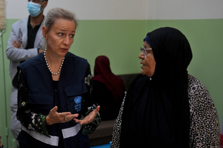 Dorothee Klaus, UNRWA's director in Lebanon, left, speaks with Munira Abu Aamsha, 63, who fled from the Palestinian refugee camp of Ein el-Hilweh, at a vocational training center run by the UNRWA in the southern town of Sebline, south of Beirut, Lebanon, Wednesday, Sept. 20, 2023. Abu Aamsha said, 