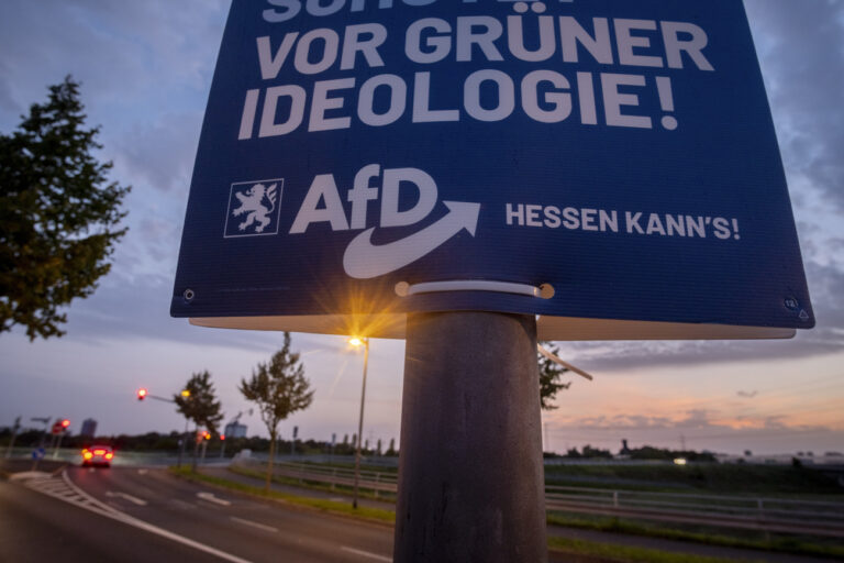 An election poster of right wing party AfD is fixed on a pole during the Hesse federal state election in Frankfurt, Germany, Sunday, Oct. 8, 2023. Hesse election were held on Sunday. (AP Photo/Michael Probst)