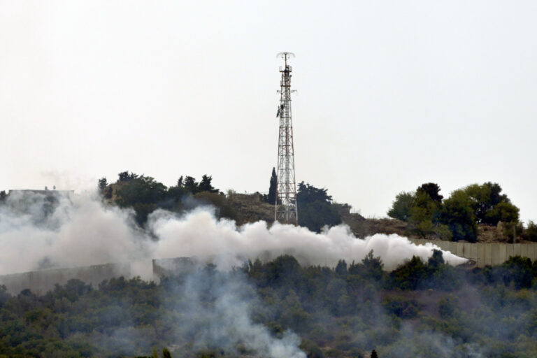 FILE - Smoke rises after Israeli shelling near an Israeli military position, background, in the village of Duhaira near the border of Israel, south Lebanon, Wednesday, Oct. 11, 2023. Lebanese militant group Hezbollah fired missiles at an Israeli military position in a northern border town of Aramsha. (AP Photo/Hassan Ammar, File)