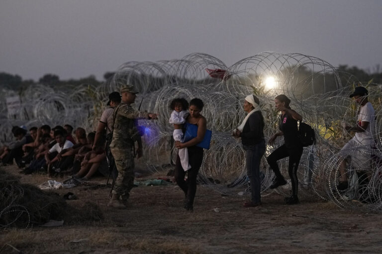 FILE - Migrants who crossed the Rio Grande and entered the U.S. from Mexico are lined up for processing by U.S. Customs and Border Protection, Saturday, Sept. 23, 2023, in Eagle Pass, Texas. (AP Photo/Eric Gay, File)