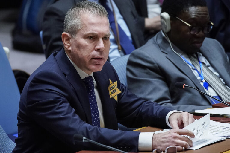 Israel's U.N. Ambassador Gilad Erdan wears a yellow Star of David that reads 