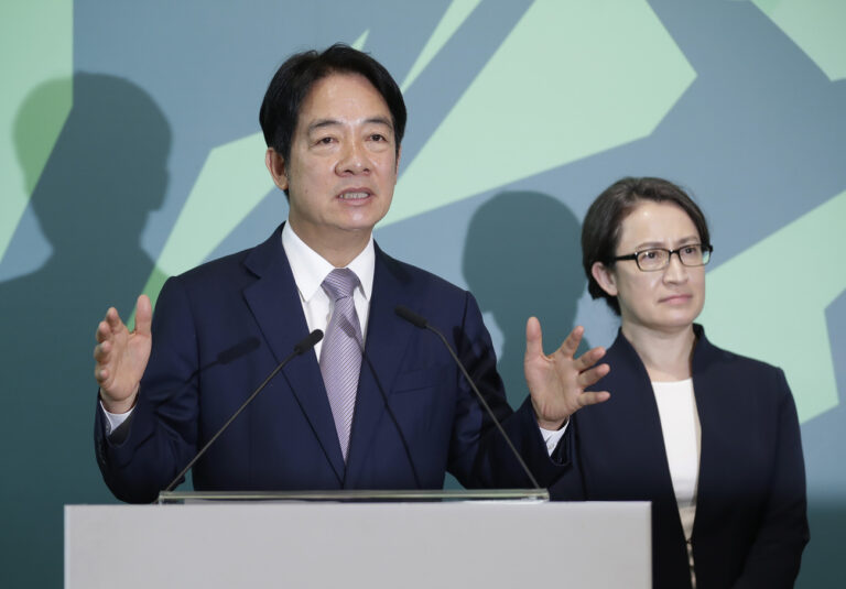 Taiwan Vice President William Lai, left, the candidate for presidential election of the ruling Democratic Progressive Party (DPP), answers a question as he was with his vice president candidate Hsiao Bi-kim, former Taiwanese representative to the United States, during a news conference in Taipei, Taiwan, Monday, Nov. 20, 2023. (AP Photo/Chiang Ying-ying)