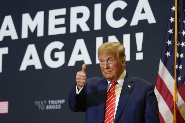 Republican presidential candidate former President Donald Trump arrives to speak at a commit to caucus rally, Saturday, Jan. 6, 2024, in Clinton, Iowa. (AP Photo/Charlie Neibergall)