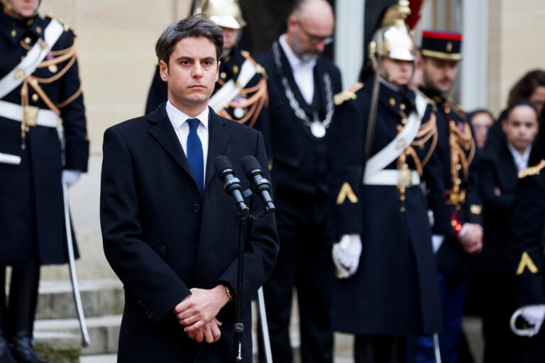epa11065938 New French Prime Minister Gabriel Attal listens to outgoing prime minister's speech in the courtyard of the Matignon Hotel during the handover ceremony in Paris, France, 09 January 2024. French Minister for National Education and Youth Gabriel Attal has been named France's new Prime Minister following the resignation of previous Prime Minister Elisabeth Borne on the evening of 08 January 2024. Gabriel Attal became France's youngest prime minister at 34 years old. EPA/LUDOVIC MARIN / POOL MAXPPP OUT