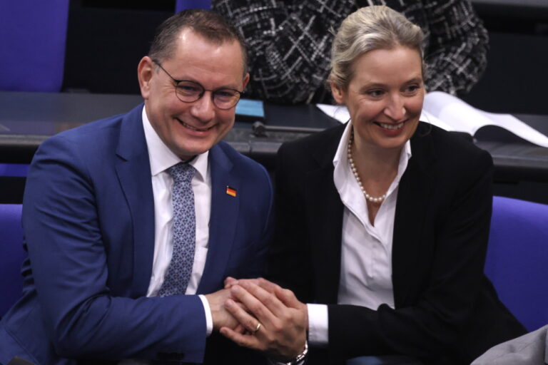 epa11119575 Alternative for Germany (AfD) party and faction co-chairman Tino Chrupalla (L) and AfD co-chairwoman Alice Weidel (R) greet each other during a session of the German parliament 'Bundestag' in Berlin, Germany, 02 February 2024. The German parliament Bundestag on 02 February is set to vote on the federal budget for the 2024 financial year. EPA/CLEMENS BILAN