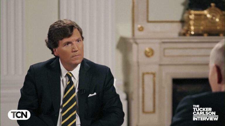 In this image made from video provided by Tucker Carlson Network, former Fox News host Tucker Carlson listens to Russian President Vladimir Putin in his interview at the Kremlin in Moscow, Russia, Tuesday, Feb. 6, 2024. (Tucker Carlson Network via AP)